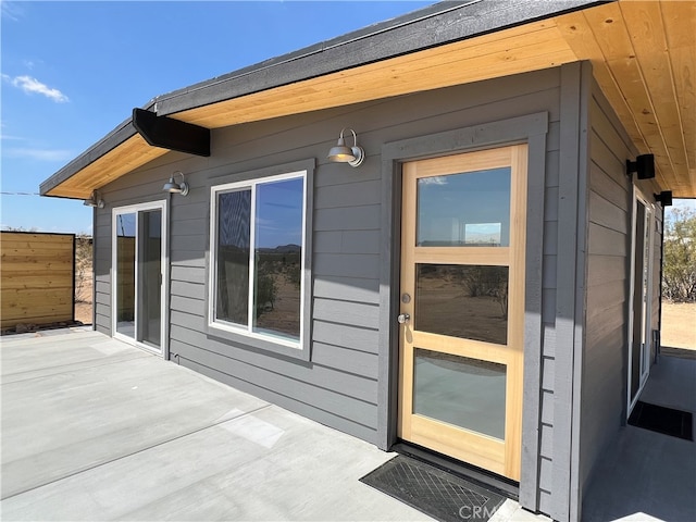 doorway to property featuring a patio area