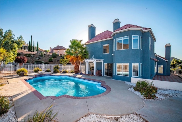 view of swimming pool featuring a patio and a pergola