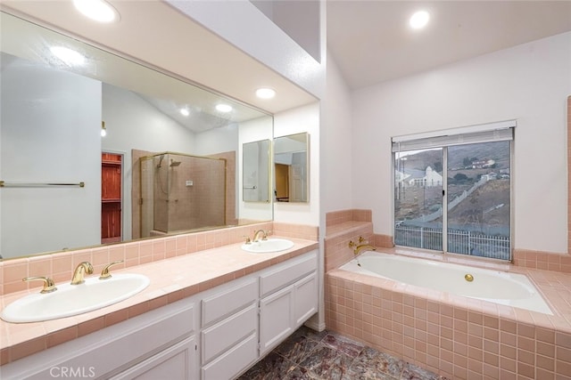 bathroom with vanity, tasteful backsplash, lofted ceiling, and separate shower and tub