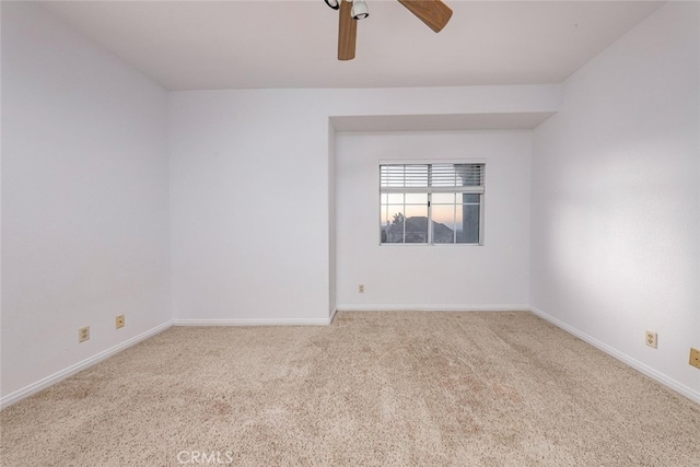 unfurnished room featuring light carpet and ceiling fan