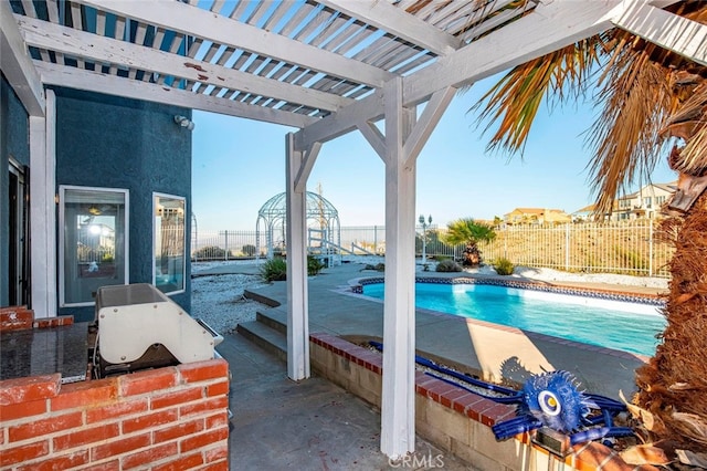 view of swimming pool with a pergola and a patio