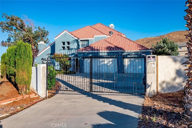 view of gate with a garage