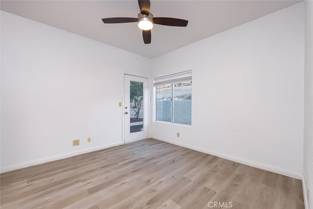 unfurnished room featuring ceiling fan and light wood-type flooring