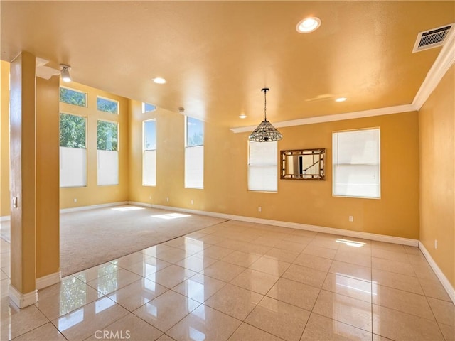 tiled empty room with crown molding