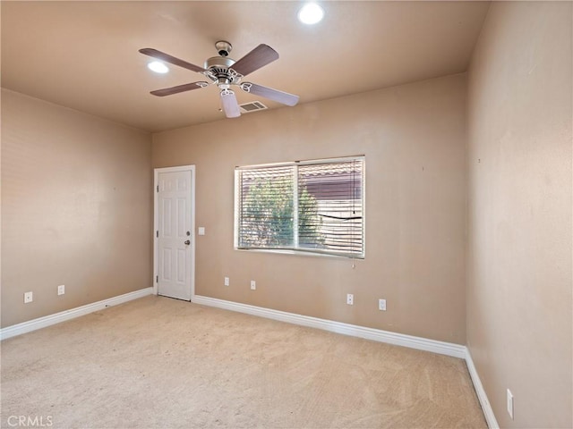 empty room with light carpet and ceiling fan