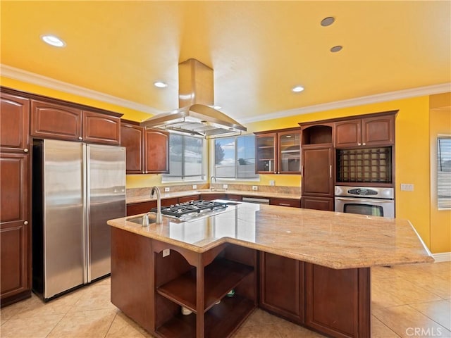 kitchen featuring a center island with sink, island exhaust hood, crown molding, light stone countertops, and stainless steel appliances