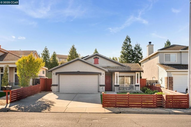 view of front of home featuring a garage and covered porch