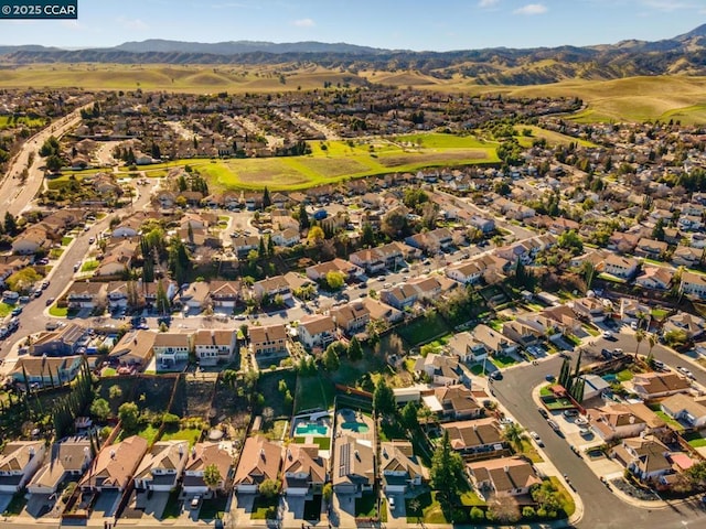 birds eye view of property with a mountain view