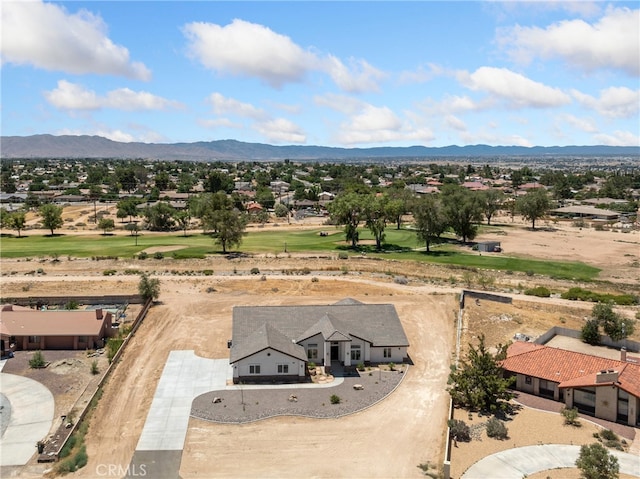 birds eye view of property with a mountain view