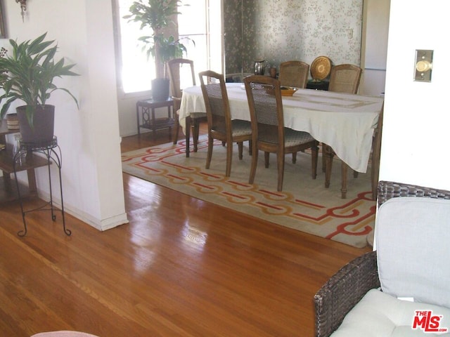 dining room with hardwood / wood-style floors