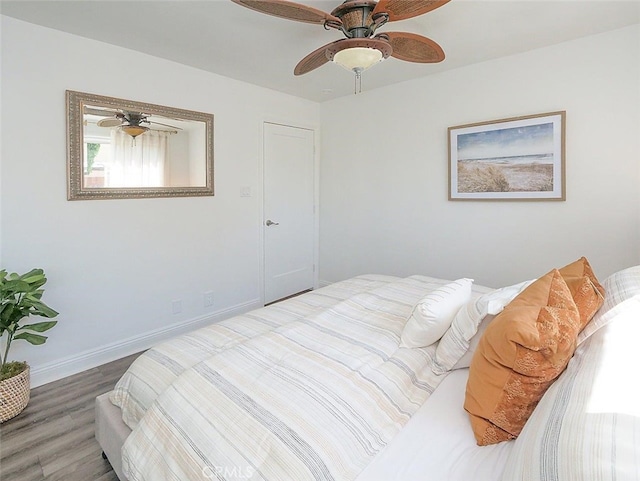 bedroom with ceiling fan and wood-type flooring