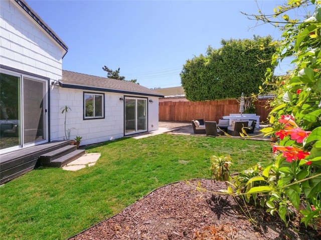 view of yard with outdoor lounge area and a patio