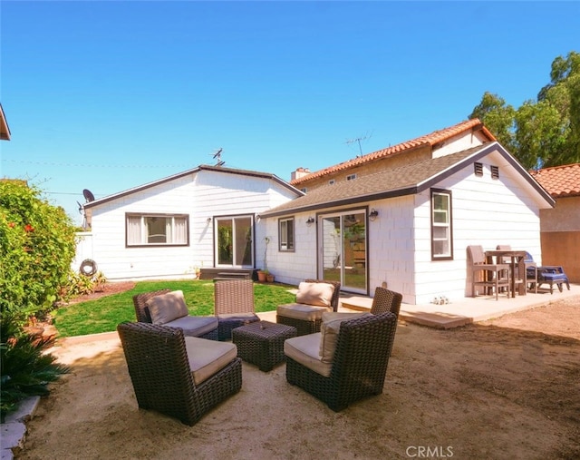 rear view of property with a patio area