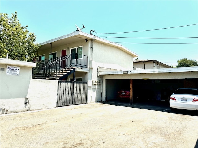 view of front of property featuring a carport