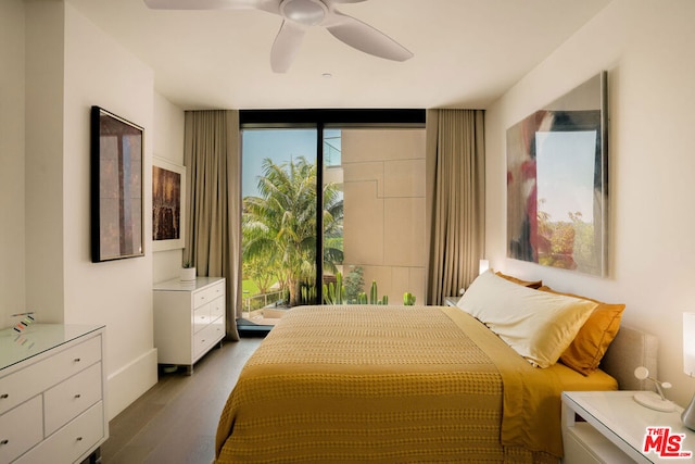 bedroom with ceiling fan and dark hardwood / wood-style floors