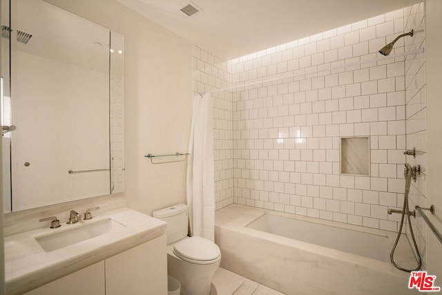 full bathroom with toilet, vanity, and shower / bathtub combination with curtain