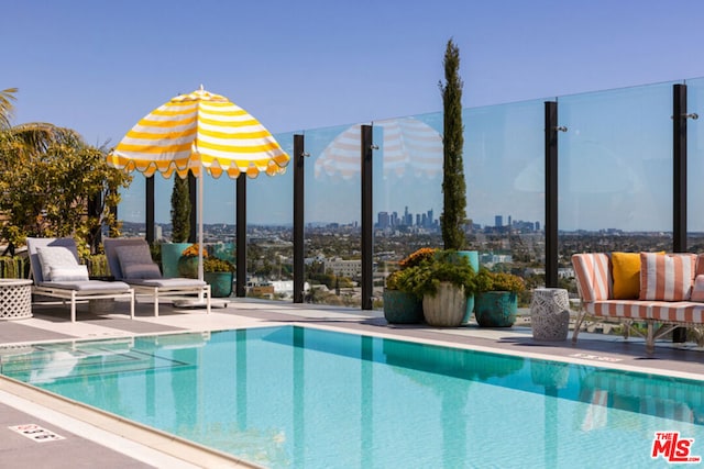 view of pool featuring a patio area and an outdoor living space