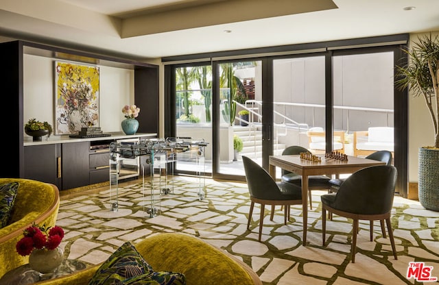 dining area featuring floor to ceiling windows