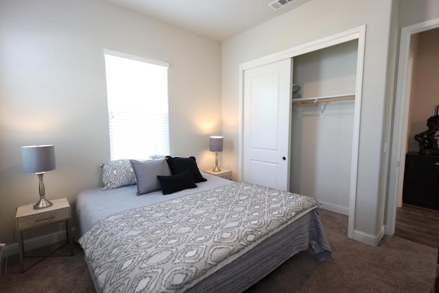 carpeted bedroom featuring a closet