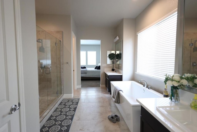 bathroom featuring tile patterned flooring, vanity, and plus walk in shower