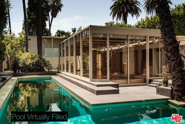 view of pool featuring a patio area