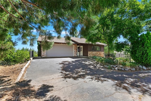 single story home featuring a garage