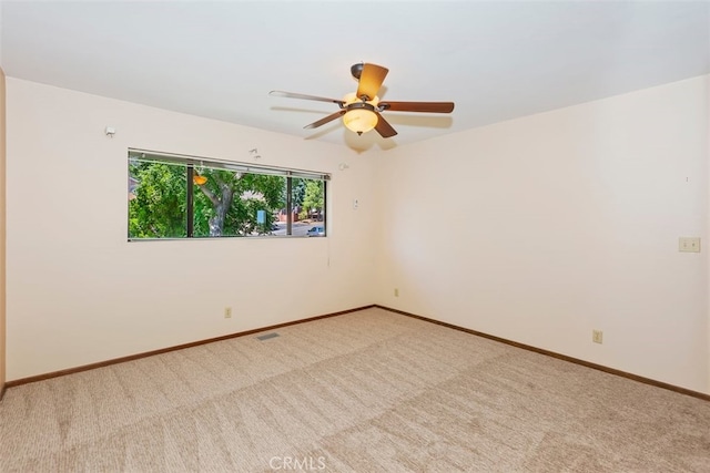 carpeted empty room with ceiling fan