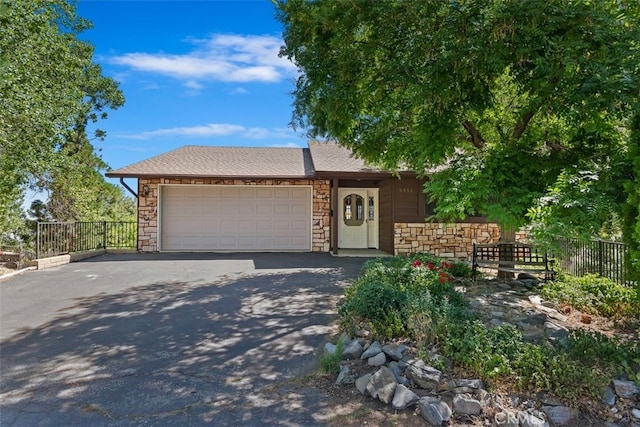 single story home featuring a garage