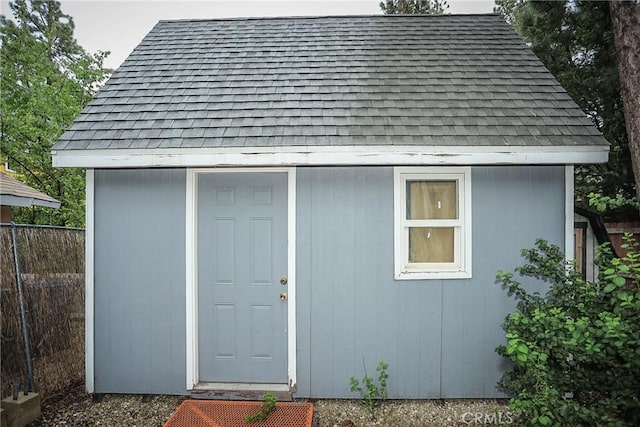 view of shed with fence