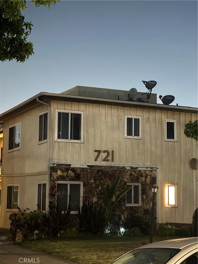 view of outdoor building at dusk