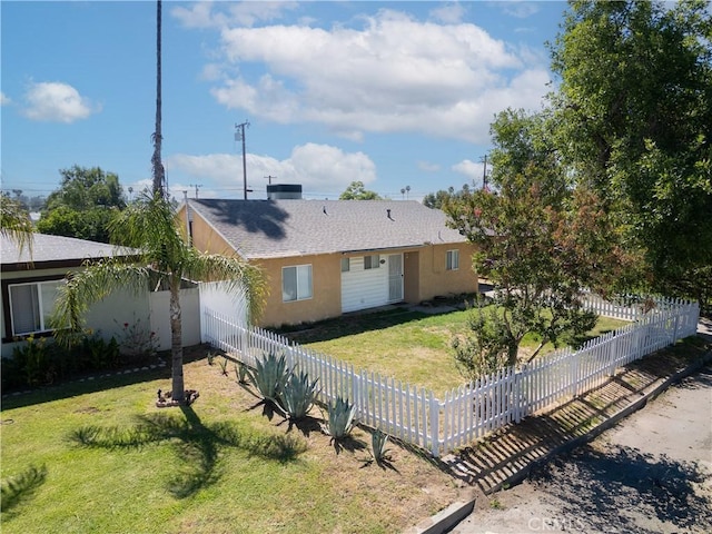 rear view of property with a yard