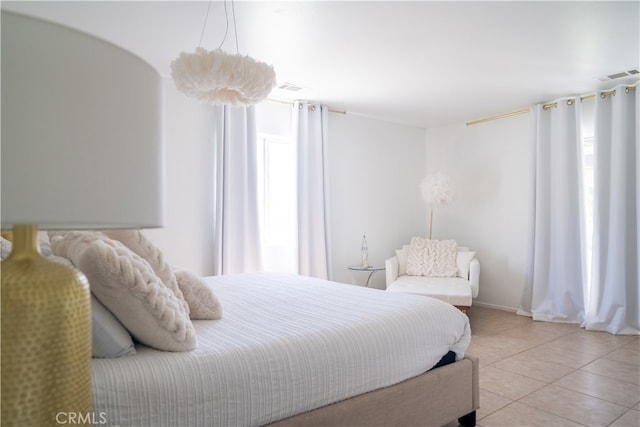 bedroom with light tile patterned flooring