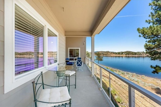 balcony featuring a water view