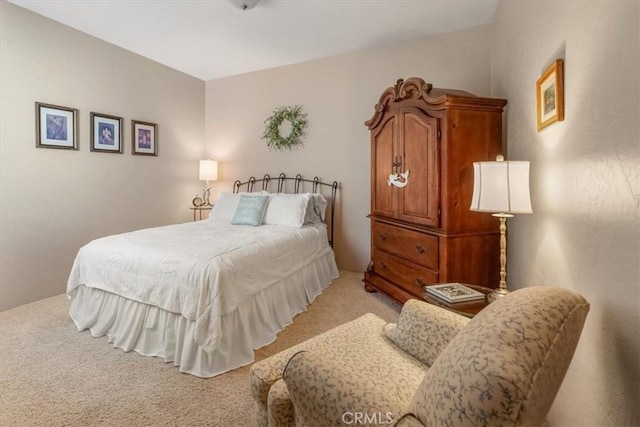 bedroom with light colored carpet