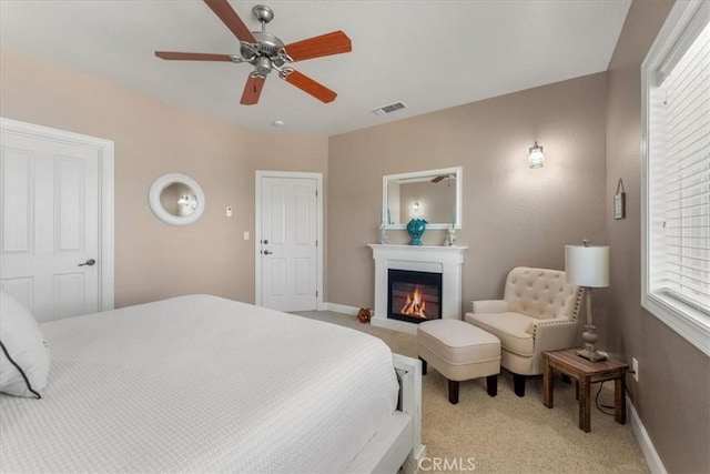 carpeted bedroom featuring ceiling fan