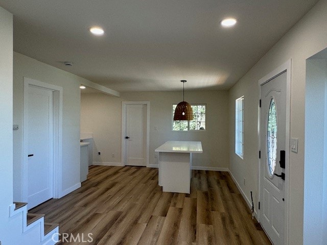 foyer entrance with dark hardwood / wood-style floors