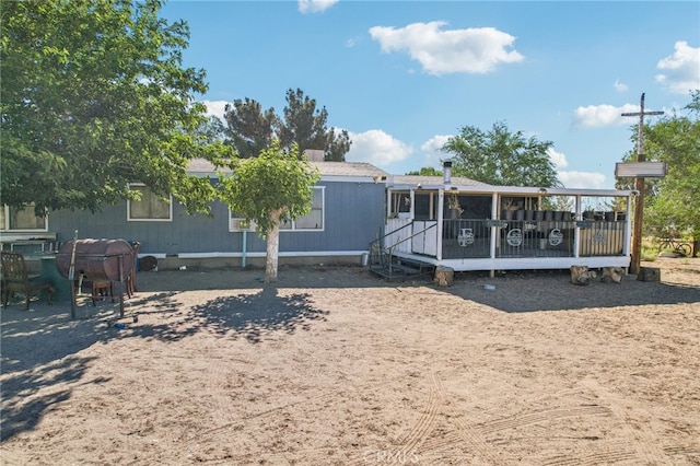 rear view of house with a deck