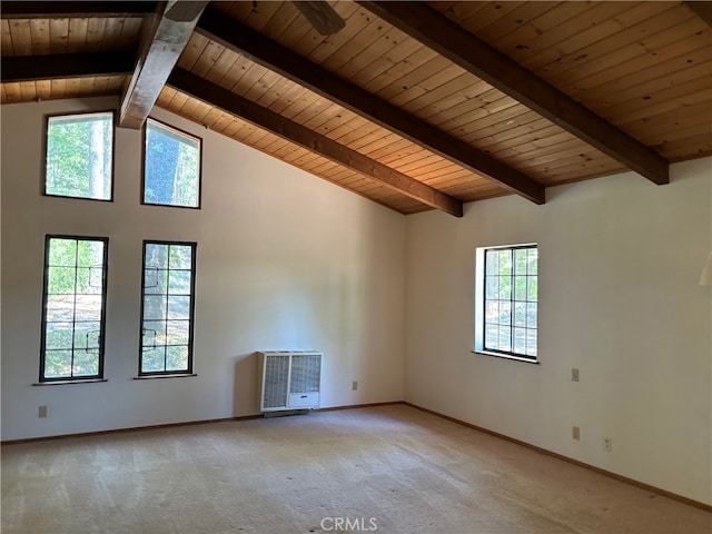 carpeted spare room with wooden ceiling, a healthy amount of sunlight, lofted ceiling with beams, and heating unit