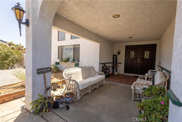 entrance to property featuring a patio area