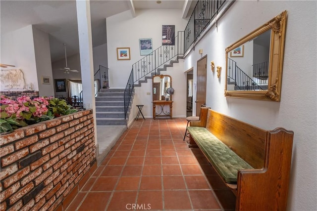 hallway featuring high vaulted ceiling, tile patterned flooring, and beamed ceiling