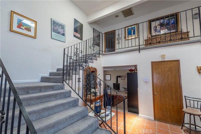 stairs with tile patterned floors