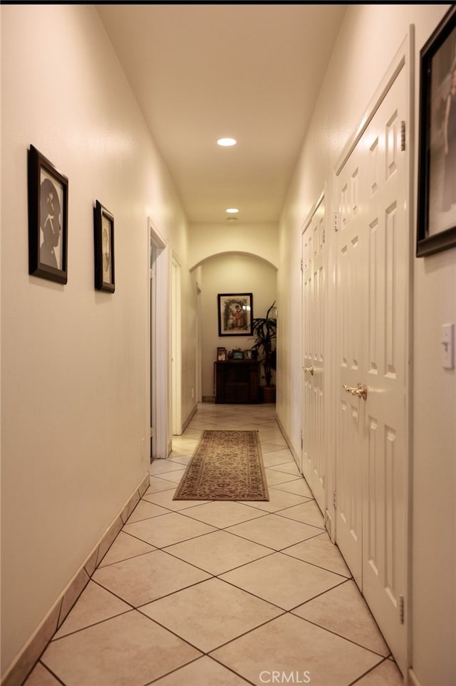 hallway featuring light tile patterned floors