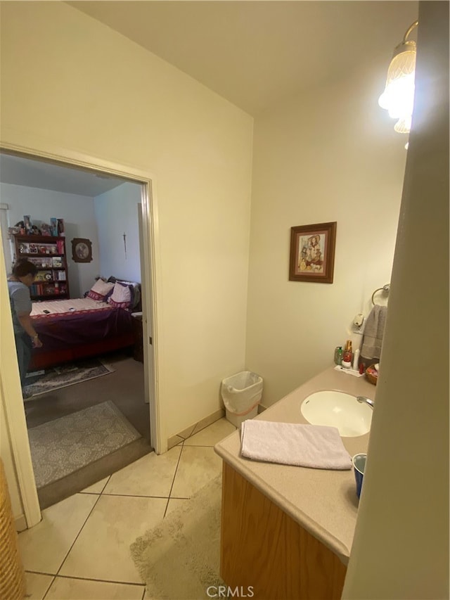 bathroom with tile patterned flooring and vanity