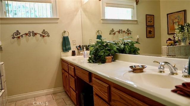 bathroom with tile patterned floors and vanity