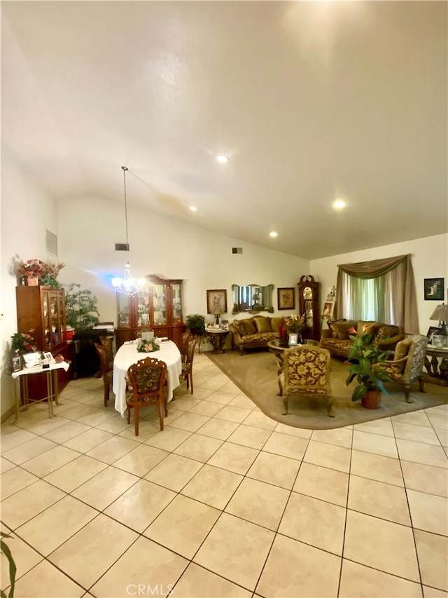 interior space featuring light tile patterned floors, a chandelier, and vaulted ceiling