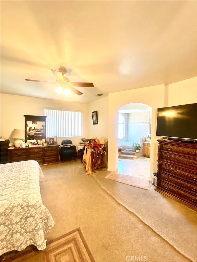 bedroom featuring ceiling fan and light colored carpet