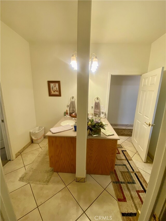 bathroom featuring a chandelier, vanity, and tile patterned flooring