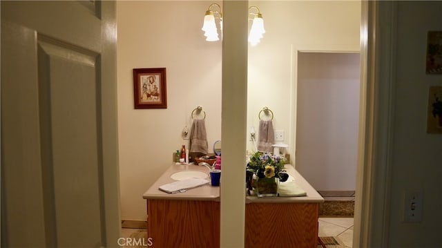 bathroom with tile patterned floors and vanity