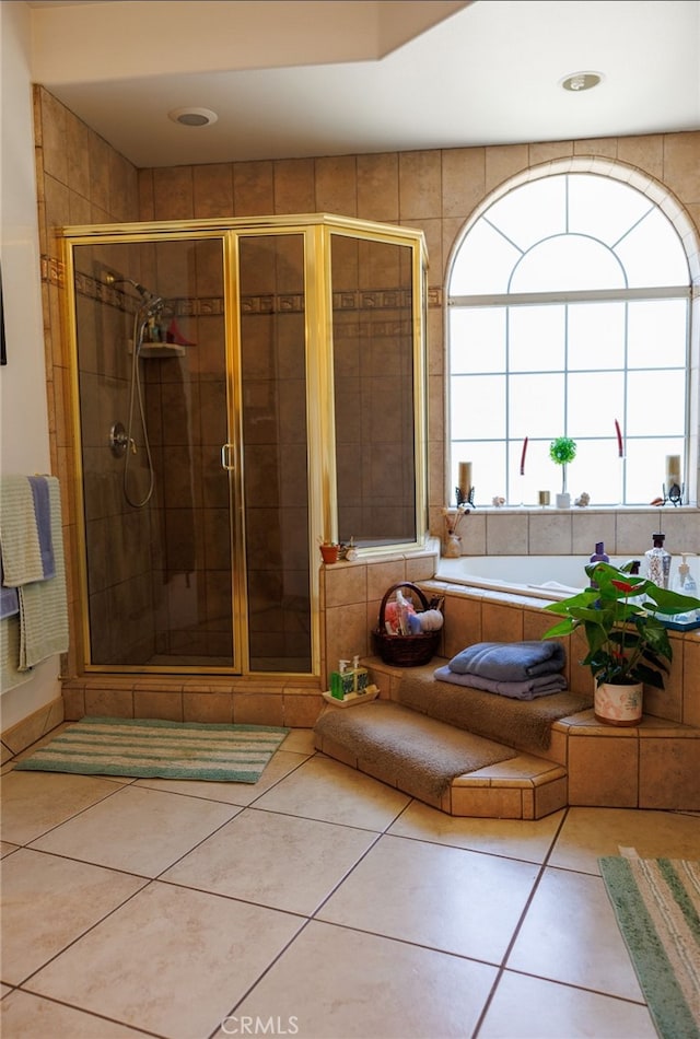 bathroom featuring tile patterned flooring and an enclosed shower