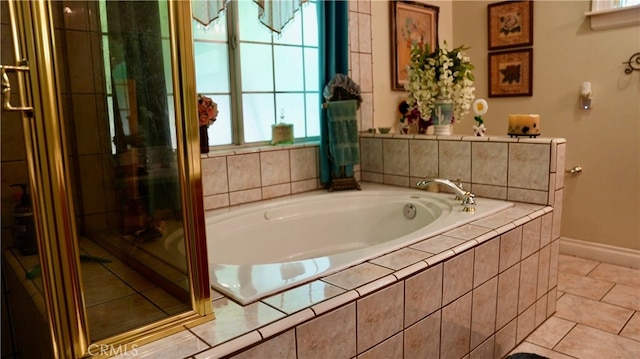 bathroom with tile patterned flooring and independent shower and bath